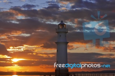 Lighthouse At Sunset Stock Photo