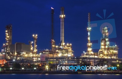 Lighting Of Oil Refinery Plant In Heavy Industry Estate Against Stock Photo