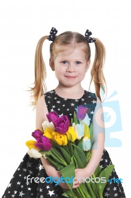 Liittle Girl With Tulips Stock Photo