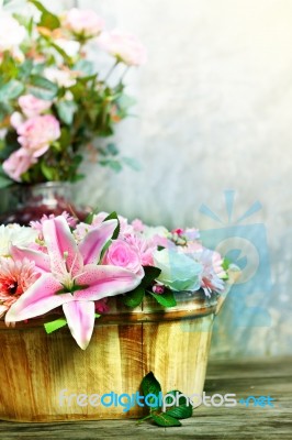 Lily Flower In Wood Bucket Stock Photo