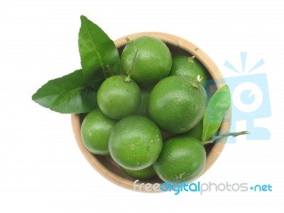 Lime And Leaf In Wood Bowl With Isolate White Background Stock Photo