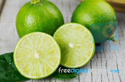 Lime Cut On Wooden Stock Photo