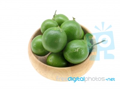 Lime In Wood Bowl With White Isolate Stock Photo