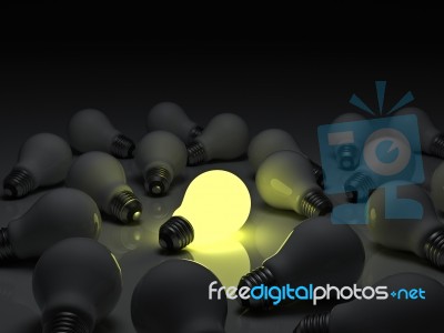 Lit Bulb Among Unlit Stock Image