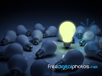 Lit Bulb Among Unlit Stock Image