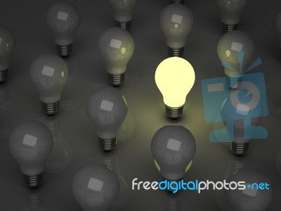 Lit Bulb Among Unlit Stock Image