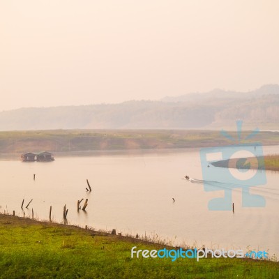 Litle Boat Near Home Boat Stock Photo