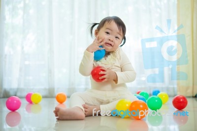 Little Asian Girl In Home Stock Photo