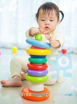 Little Asian Girl In Home Stock Photo