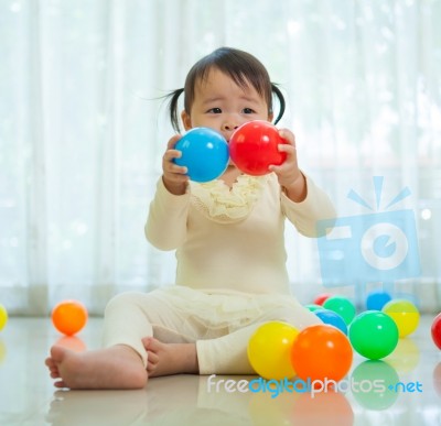 Little Asian Girl In Home Stock Photo