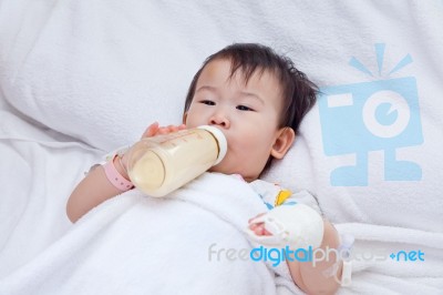 Little Asian Girl Lying  On A Medical Bed Stock Photo