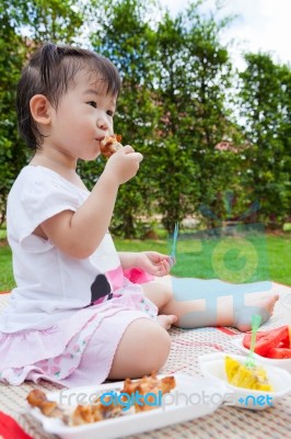 Little Asian (thai) Girl Enjoy Eating Her Lunch Stock Photo