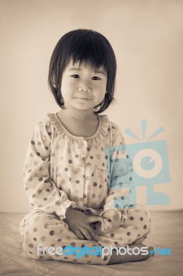 Little Asian (thai) Girl Sitting. Vintage And Retro Picture Styl… Stock Photo