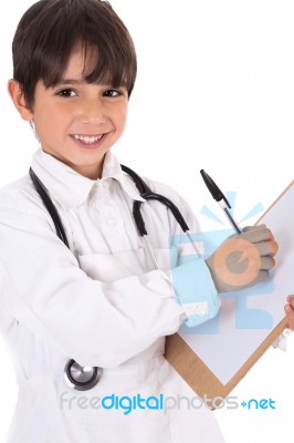 Little Boy Doctor Writes On His Clipboard For Diagnosis Stock Photo