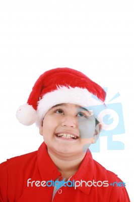 Little Boy In Santa Hat Stock Photo