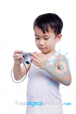 Little Boy  Interesting Digital Compact Photo Camera Stock Photo