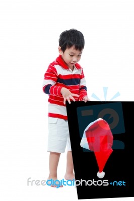 Little Boy Looking Santa Hat With The Blackboard ,isolated On White Stock Photo