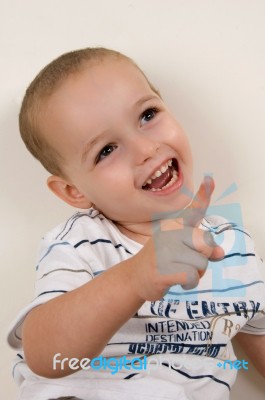 Little Boy Pointing Upward Stock Photo