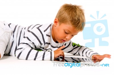 Little Boy Using Digital Tablet Stock Photo