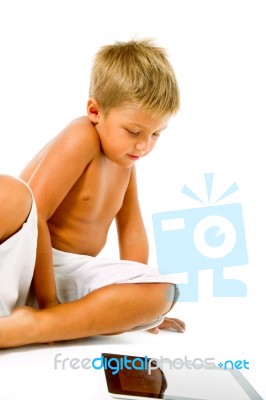 Little Boy Using Digital Tablet Stock Photo