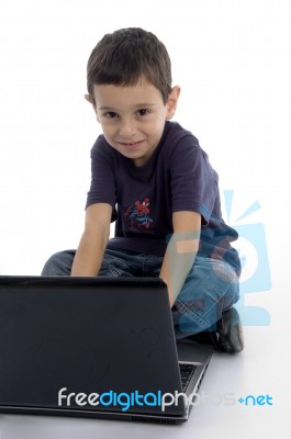 Little Boy Working with Laptop Stock Photo