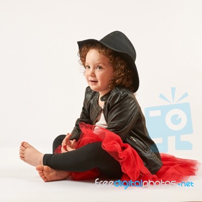 Little Girl Fashion Model With Black Hat Stock Photo