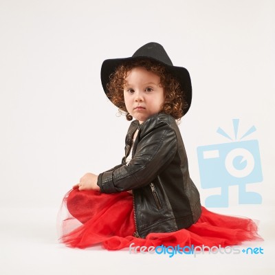 Little Girl Fashion Model With Black Hat Stock Photo