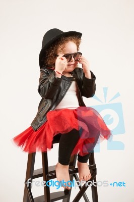 Little Girl Fashion Model With Black Hat Stock Photo