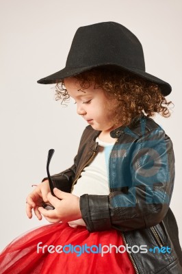 Little Girl Fashion Model With Black Hat Stock Photo