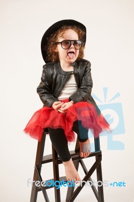 Little Girl Fashion Model With Black Hat Stock Photo