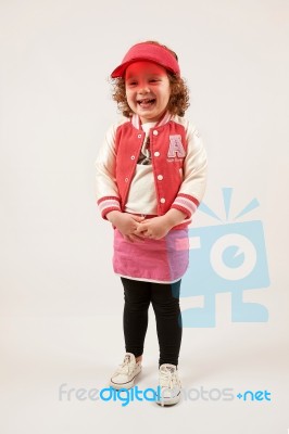 Little Girl Fashion Model With Red Cap Stock Photo