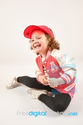 Little Girl Fashion Model With Red Cap Stock Photo