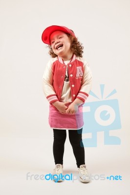 Little Girl Fashion Model With Red Cap Stock Photo