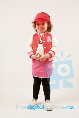 Little Girl Fashion Model With Red Cap Stock Photo