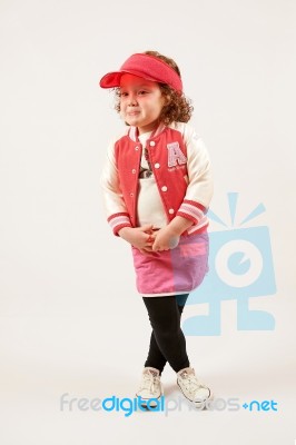 Little Girl Fashion Model With Red Cap Stock Photo