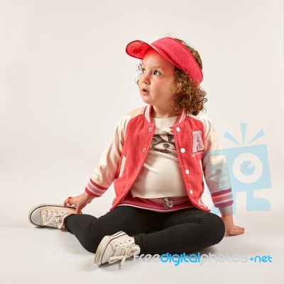 Little Girl Fashion Model With Red Cap Stock Photo