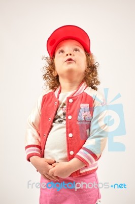 Little Girl Fashion Model With Red Cap Stock Photo