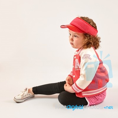 Little Girl Fashion Model With Red Cap Stock Photo