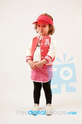 Little Girl Fashion Model With Red Cap Stock Photo