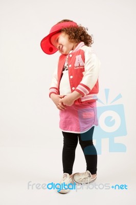 Little Girl Fashion Model With Red Cap Stock Photo