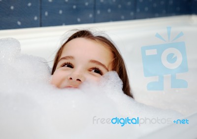 Little Girl In Bath Stock Photo