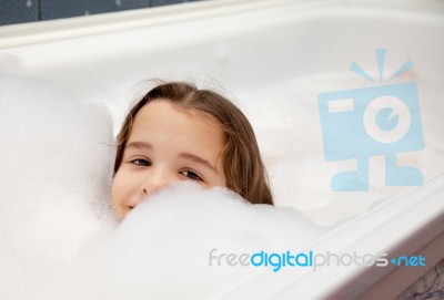 Little Girl In Bath Stock Photo