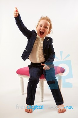 Little Girl In Black Suit Stock Photo