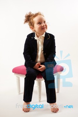 Little Girl In Black Suit Stock Photo