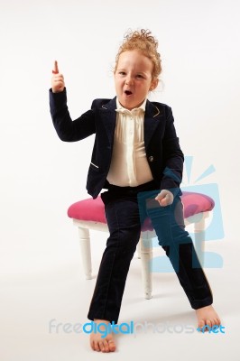 Little Girl In Black Suit Stock Photo