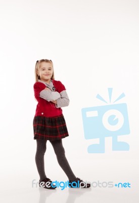 Little Girl In Red Dress Posing Standing In Studio Stock Photo