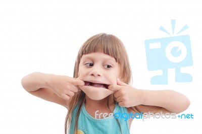 Little Girl Making A Strange Face On White Background Stock Photo