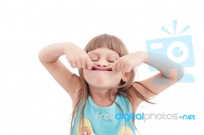 Little Girl Making Funny Face, Isolated On White Stock Photo