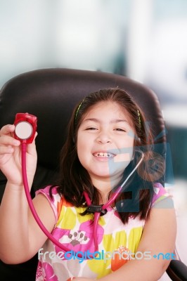 Little Girl Playing Doctor With Stethoscope Stock Photo