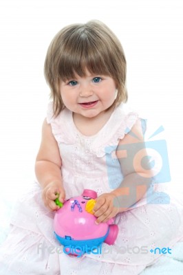 Little Girl Playing With Toy Stock Photo